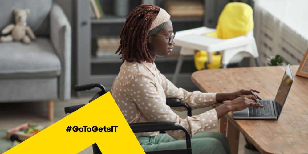 Woman working on a laptop from home underscoring the need for cybersecurity in BFSI industry